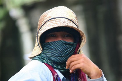 Southeast Asia, Cambodian woman covered. © Eric Lafforgue www.ericlafforgue.com