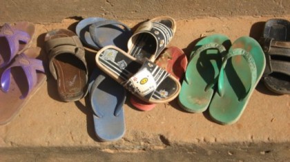 Southeast Asia, Shoes outside of a school in Cambodia. Photo: KateInJapan