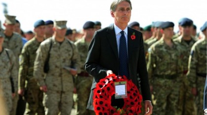 Defence Secretary Philip Hammond joined British troops at Camp Bastion, who fell silent at 11:00 local time (06:30 GMT). He said the recent deaths of soldiers in Afghanistan served to underline the importance of the act of remembrance. Photo: BBC.