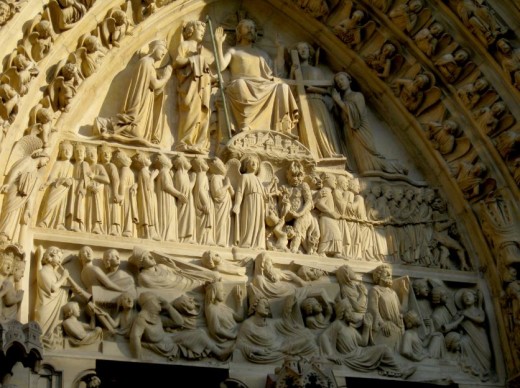Detail of the tympanum of Notre Dame Cathedral in Paris. Notice the blessed to the right of Jesus and the dammed to his left, being pushed and shoved by a few demons?